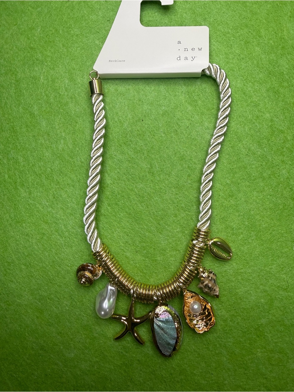 a new day Gold color and Cream Rope Necklace with Beach Charms